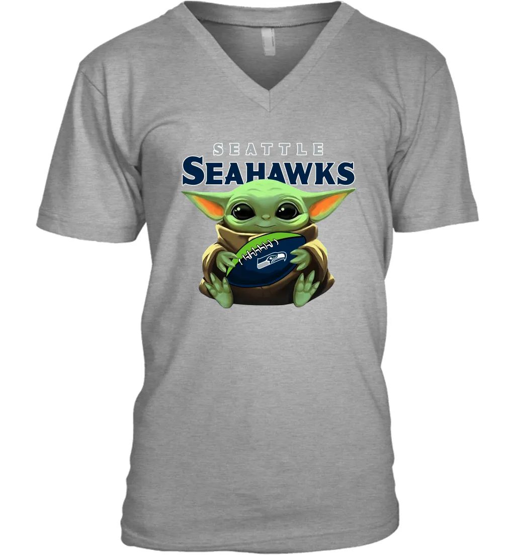 Baby Yoda Loves The Seattle Seahawks Star Wars Baby Yoda Hugs Seahawks NFL Mens V-Neck T-Shirt