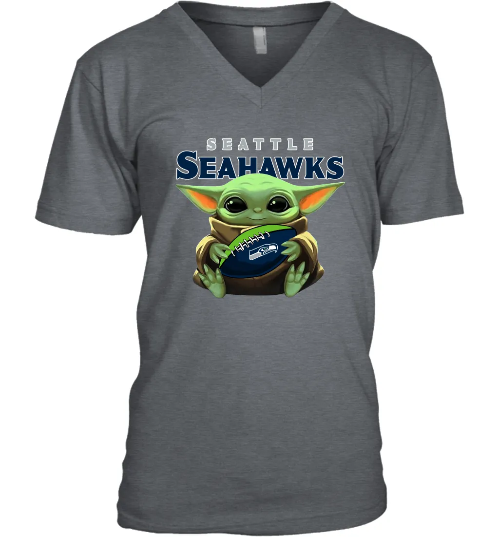 Baby Yoda Loves The Seattle Seahawks Star Wars Baby Yoda Hugs Seahawks NFL Mens V-Neck T-Shirt