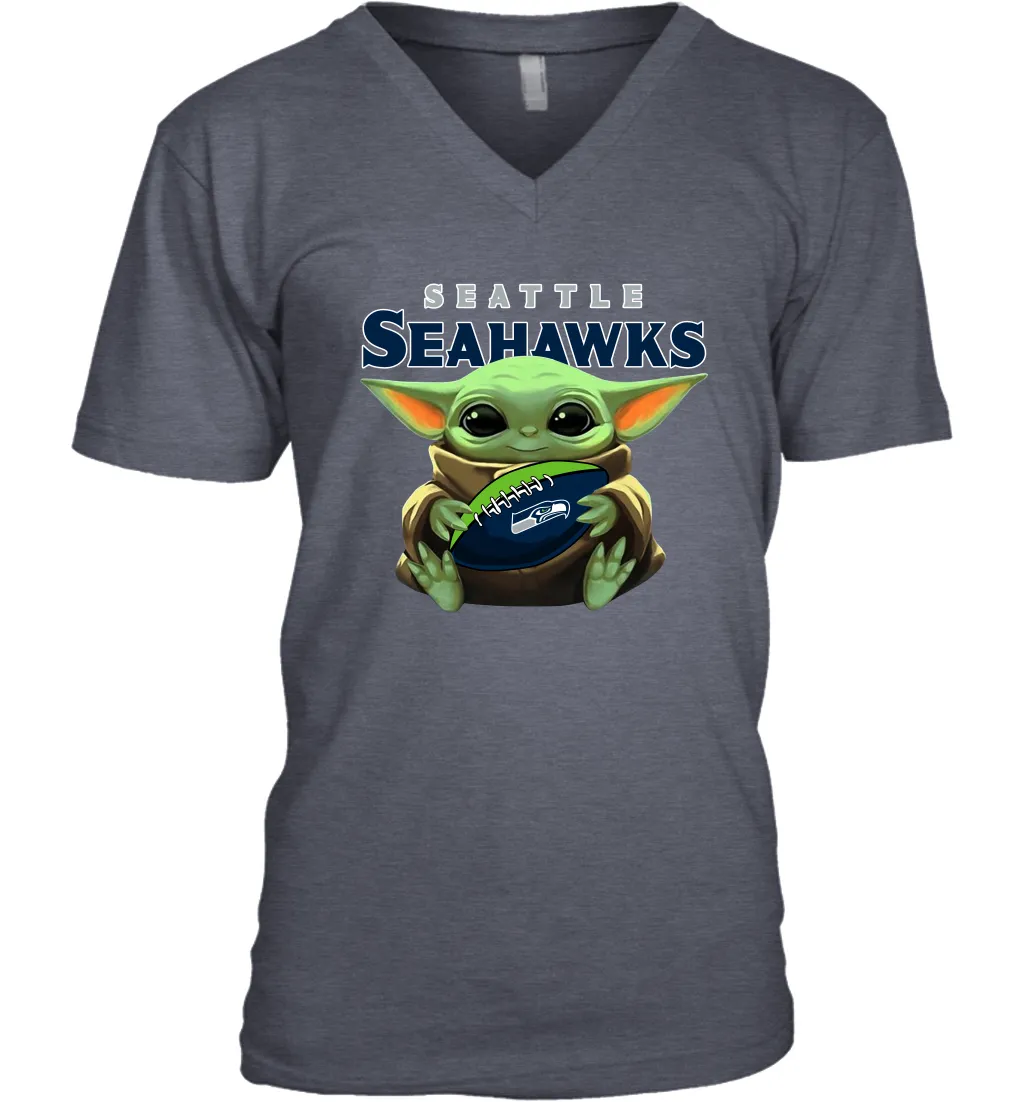 Baby Yoda Loves The Seattle Seahawks Star Wars Baby Yoda Hugs Seahawks NFL Mens V-Neck T-Shirt