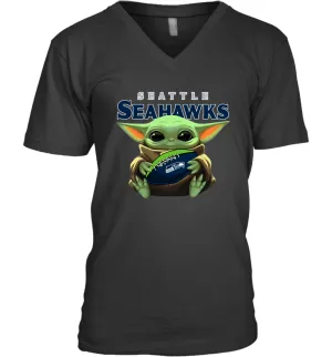 Baby Yoda Loves The Seattle Seahawks Star Wars Baby Yoda Hugs Seahawks NFL Mens V-Neck T-Shirt