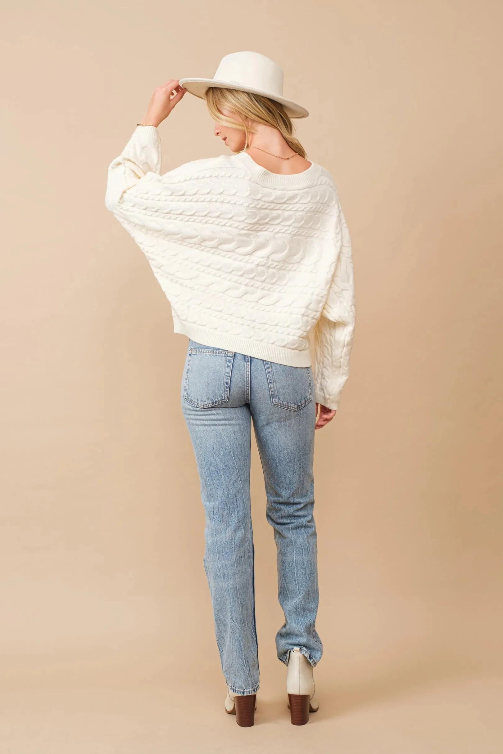 Horizontal cable knit dolman sleeve sweater