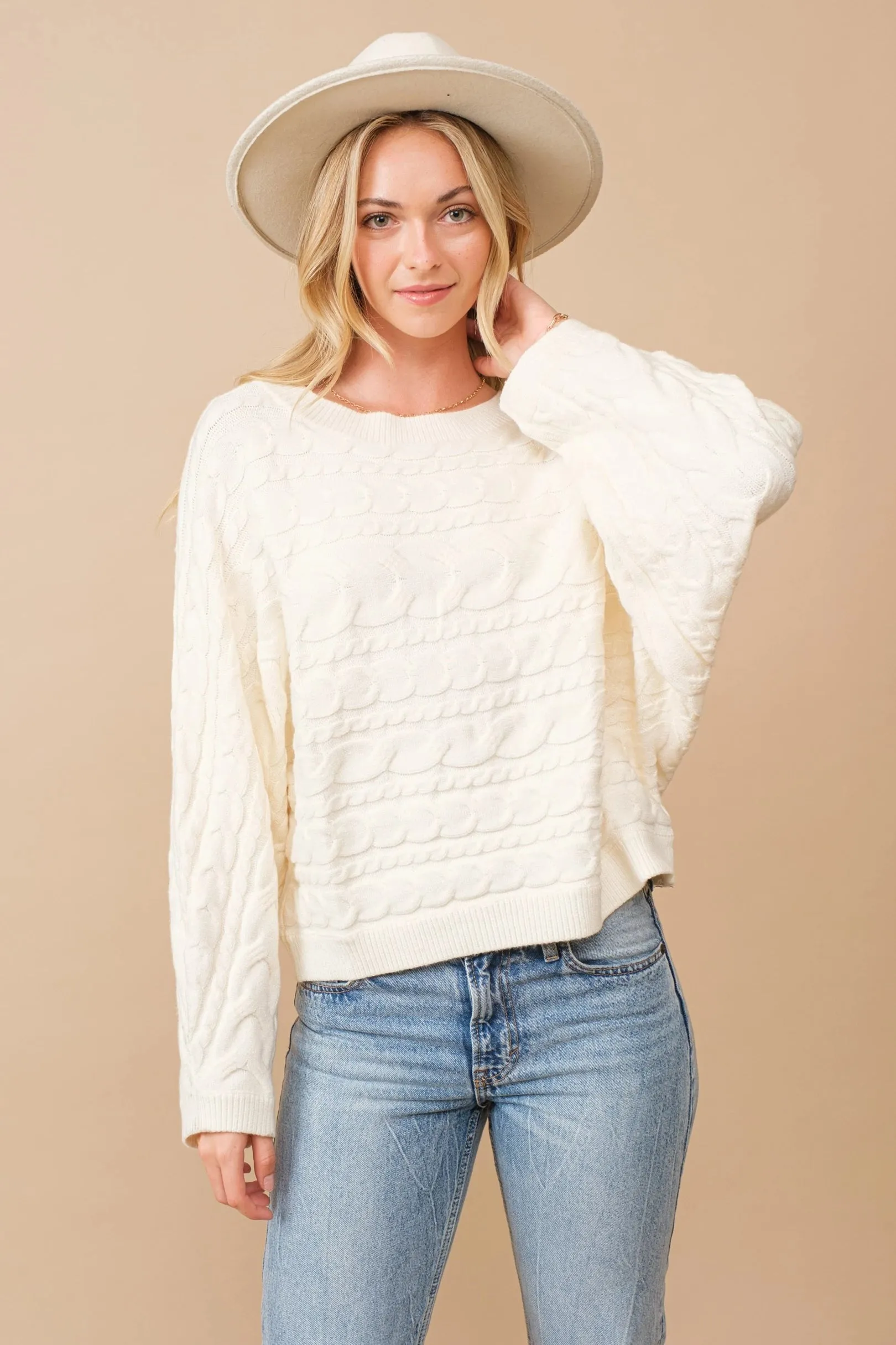 Horizontal cable knit dolman sleeve sweater